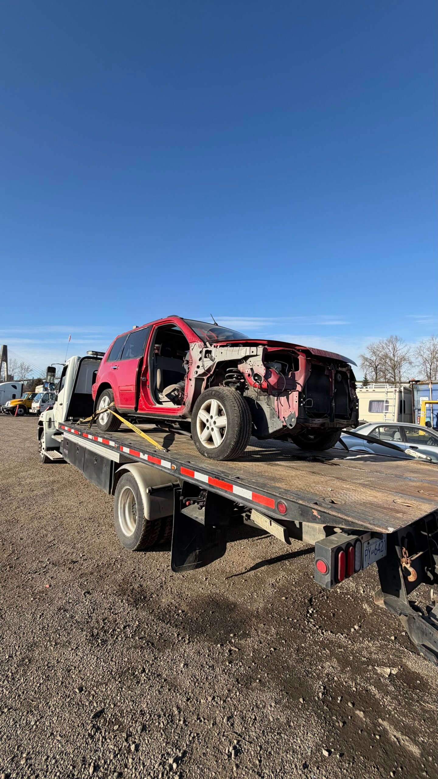 Scrap vehicle winched from a Ladner driveway