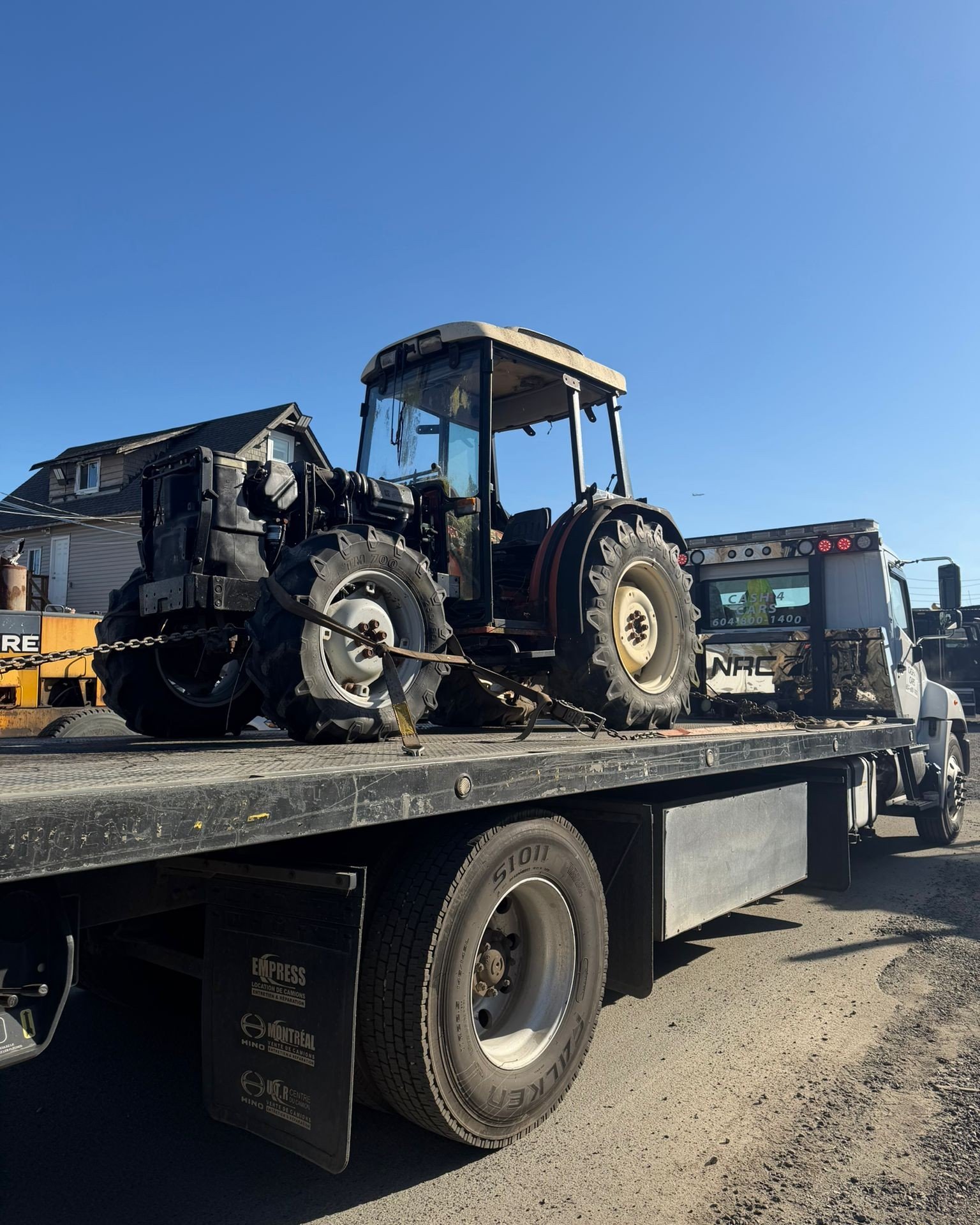 Forklift secured on a flatbed truck